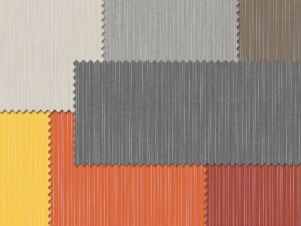 Een patchwork van verschillende stoffen in verschillende kleuren en texturen, waaronder grijs, geel, oranje en bruin.