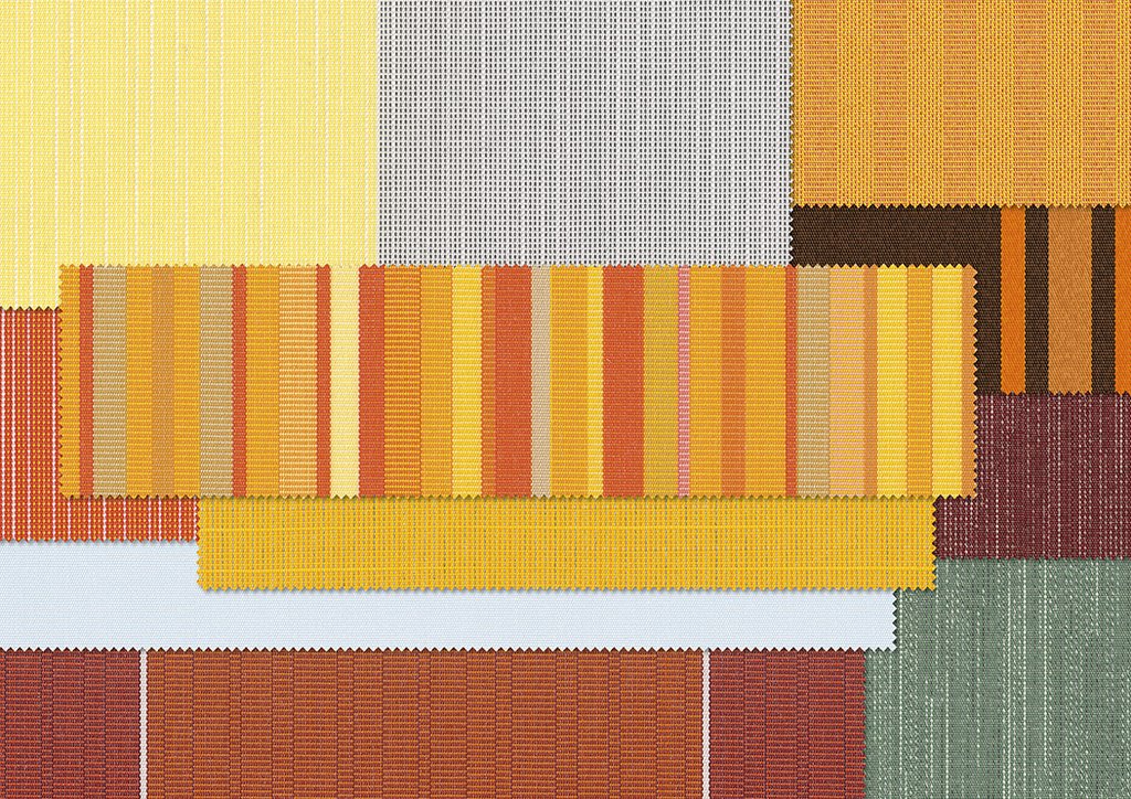 Een kleurrijke patchwork van textiel met gele, oranje en bruine tinten.