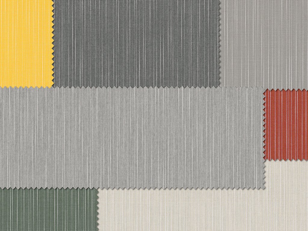 Stoftextuur met rechthoekige vlakken in geel, grijs, zwart, groen en rood.