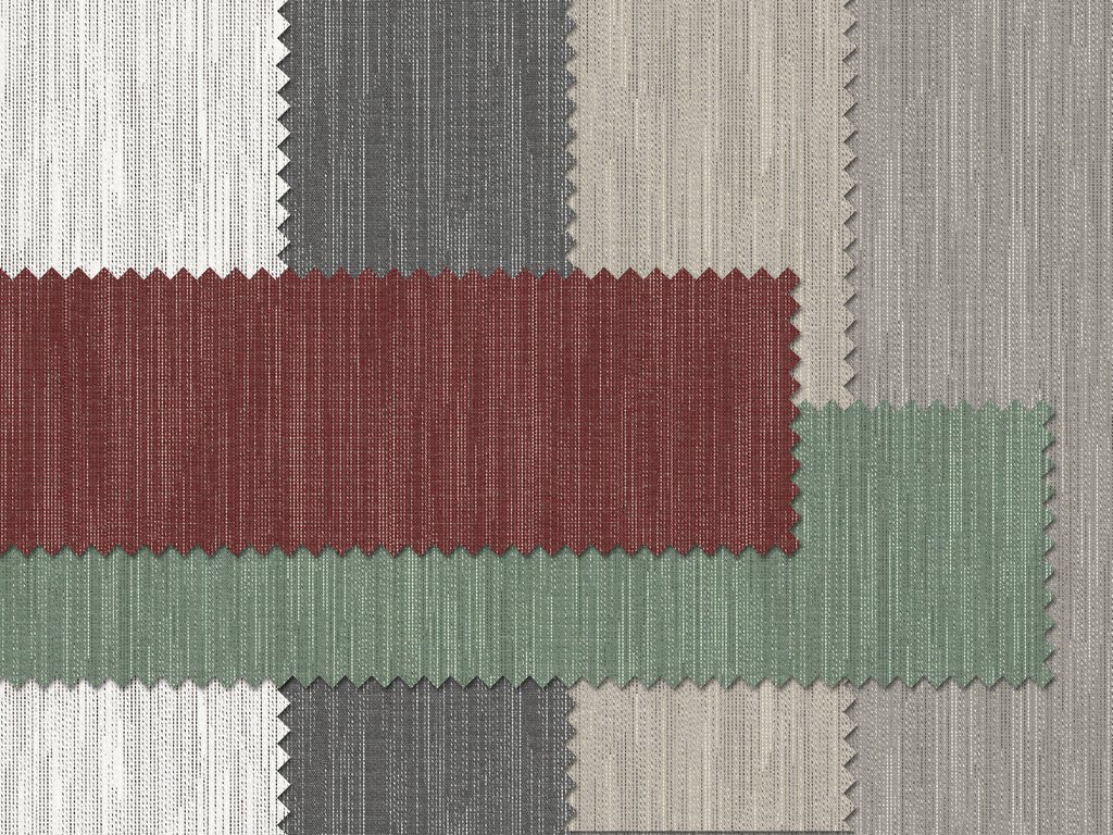 Textiele stoffen in diverse kleuren, waaronder rood, groen, grijs en wit, met gestructureerde patronen.