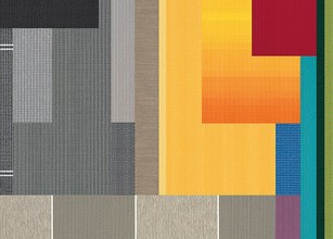 A vibrant arrangement of various textured colours, including yellow, red, and blue. 